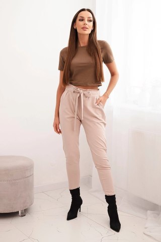Spodnie damskie bawełniane z wiązaniem w pasie i zwężaną nogawką beżowe