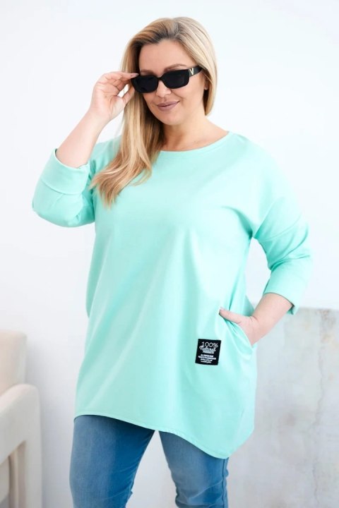 Bluzka damska Plus Size z dłuższym tyłem i długim rękawem miętowa
